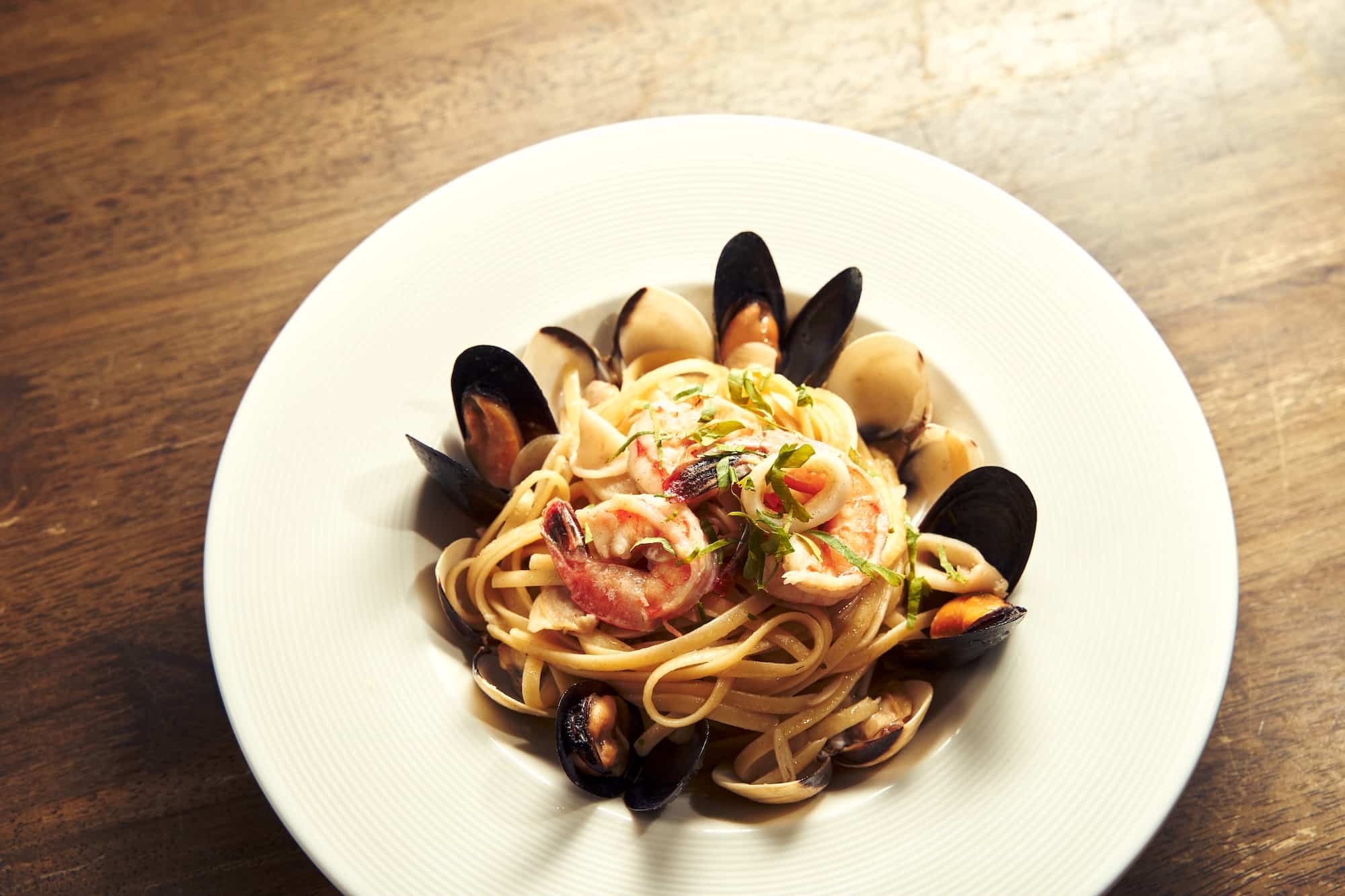 Seafood olio (linguine with local sweet prawns, Chilean mussels, clams, and squid)