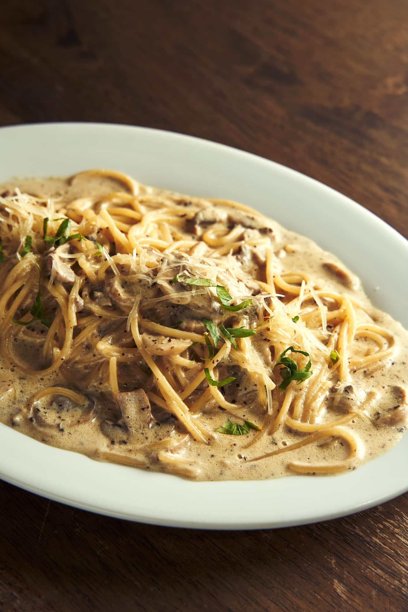 Lucio's truffle (spaghetti with creamy truffle sauce, brown button mushrooms, and Parmesan)