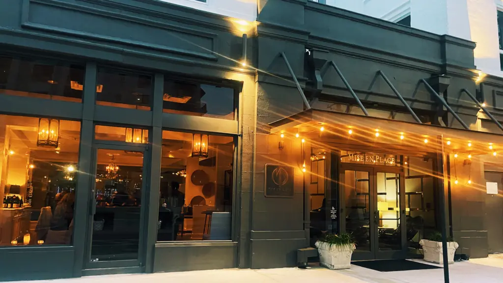 exterior of a restaurant with a black wood facade