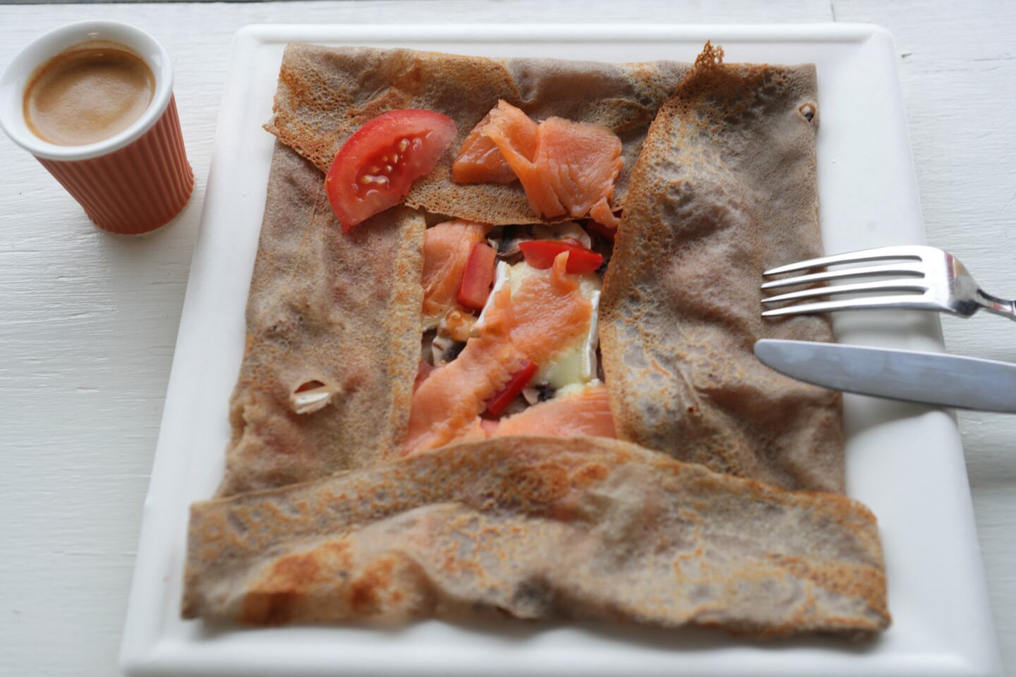 At MA France, a buckwheat galette with smoked salmon, brie, mushrooms, and tomatoes.