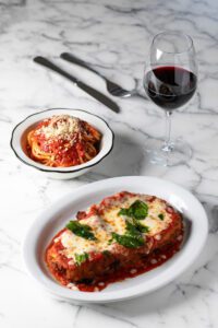 Chicken scallopini parmigiano with a side of pasta is a popular favorite that can easily fill you plus a to-go bag.