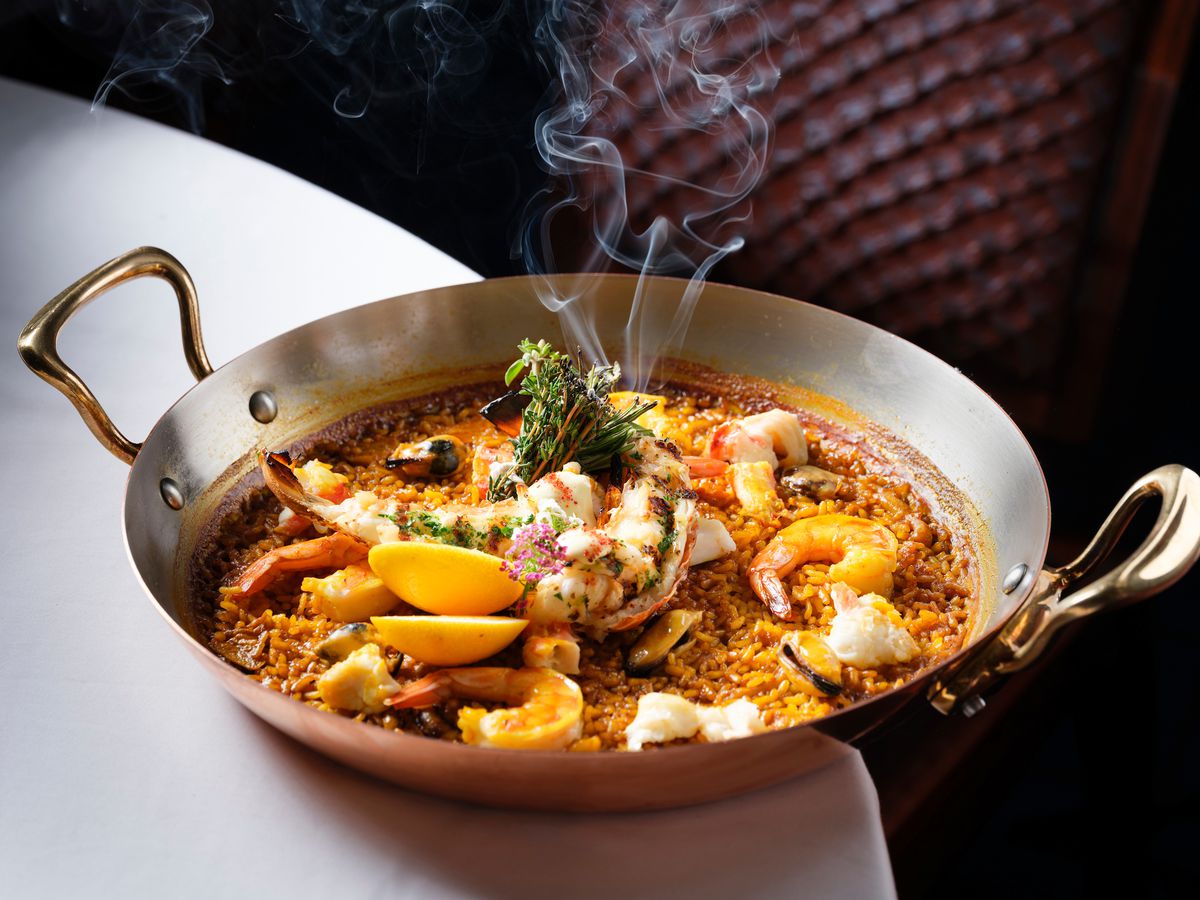 A steaming bowl of seafood paella.