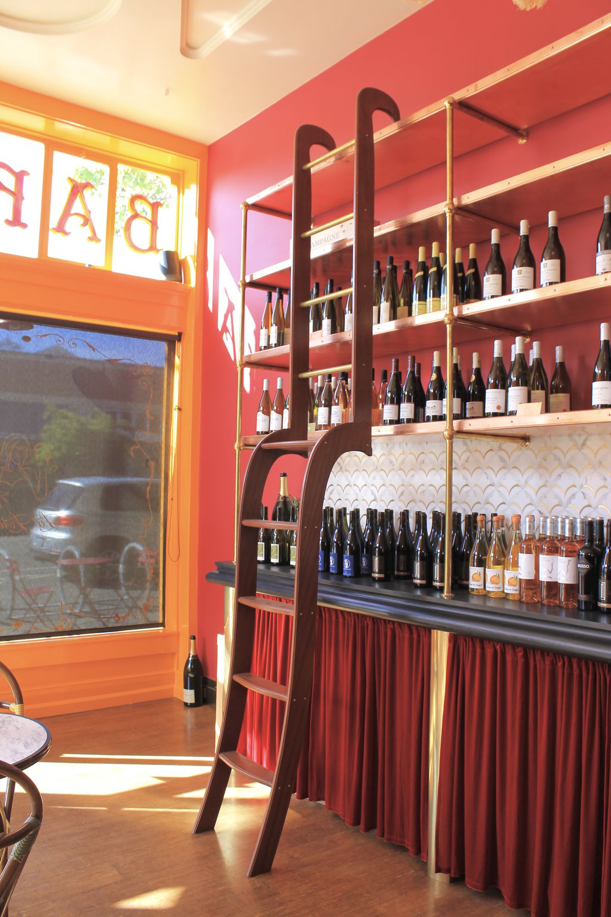 A ladder used to get wine off of a high shelf.