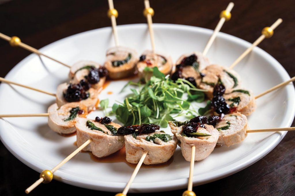 Pork roulade with cherry gastrique. Photo by Nick Shirghio