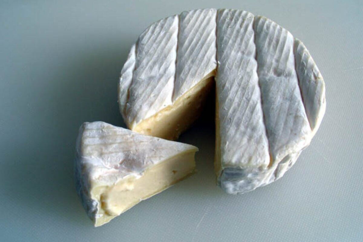 Wheel of Camembert with slice taken out