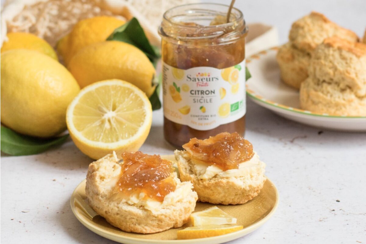 Jar of marmalade and biscuits with marmalade and butter