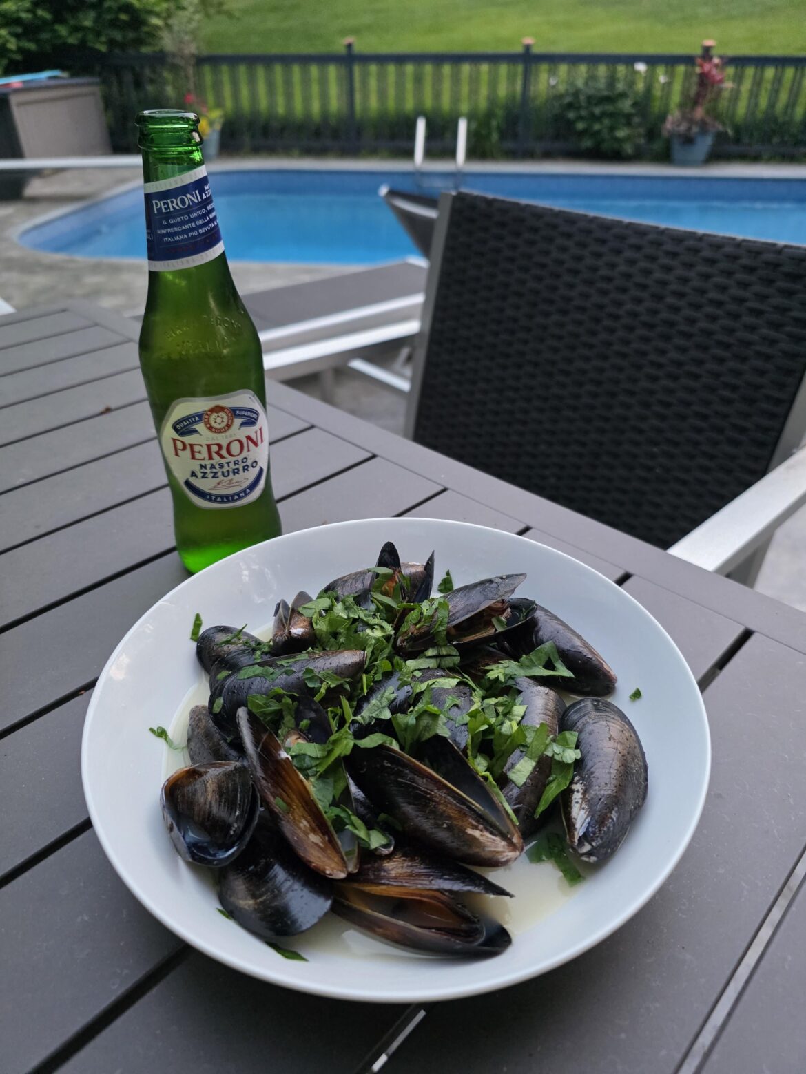 Mussels steamed in beer and butter with Italian dark parsley