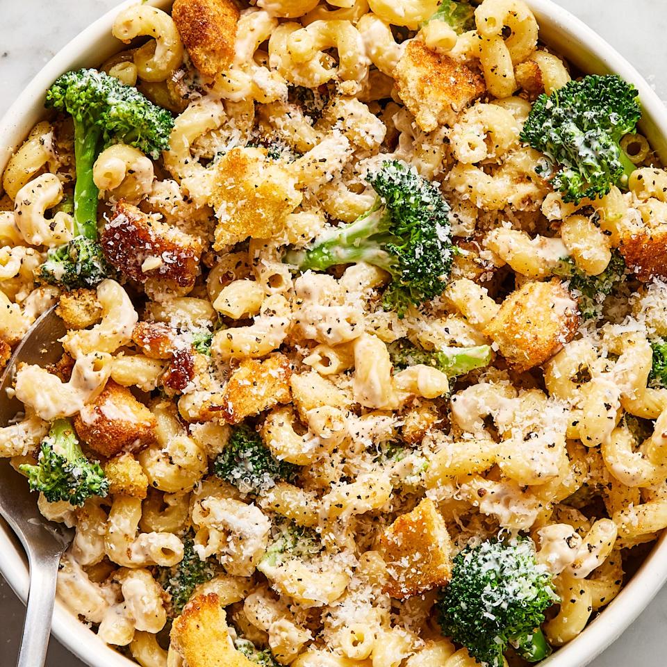 broccoli caesar pasta salad topped with crunchy croutons