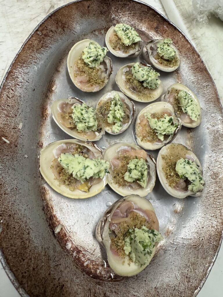 Broiled little necks with ramp and wild onion butter