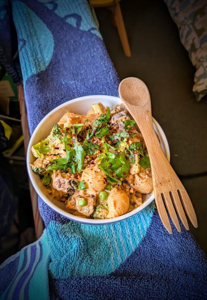 Pasta with sausage, broccoli, mushrooms, peas and homemade sauce