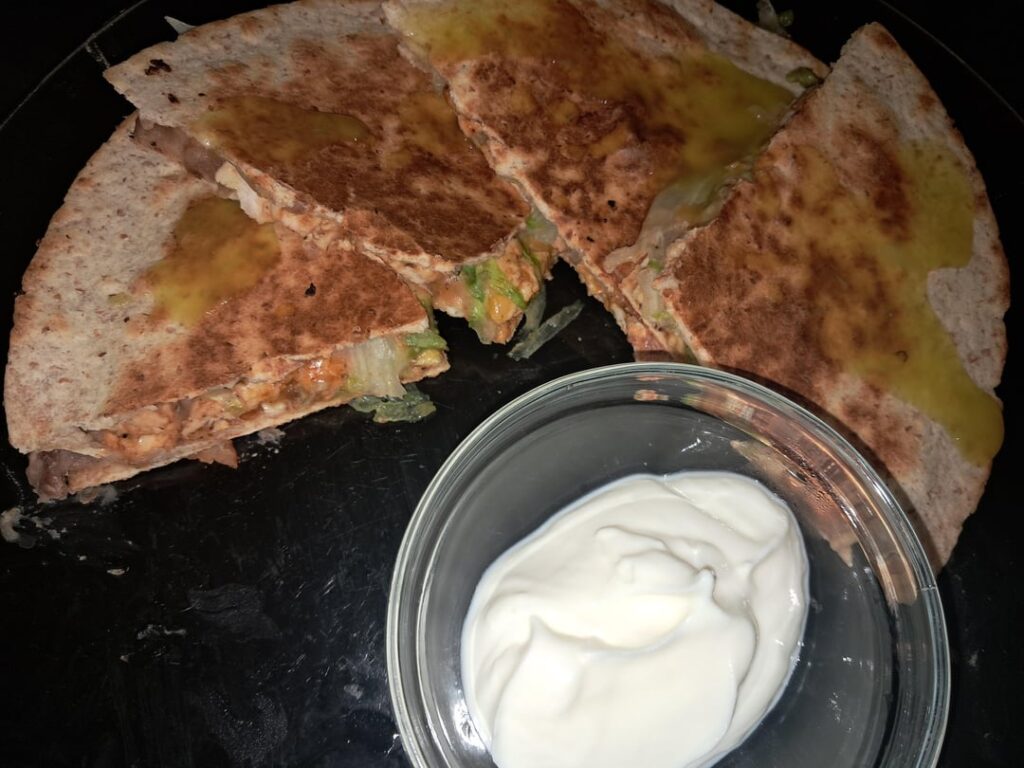 Chicken quesadillas smothered in salsa verde