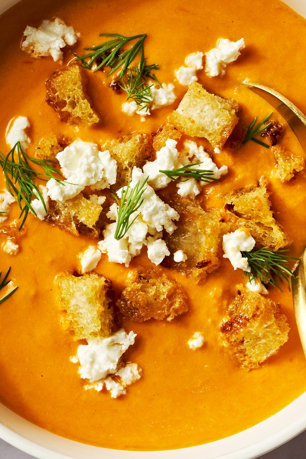baked feta soup with crumbled feta and fresh dill