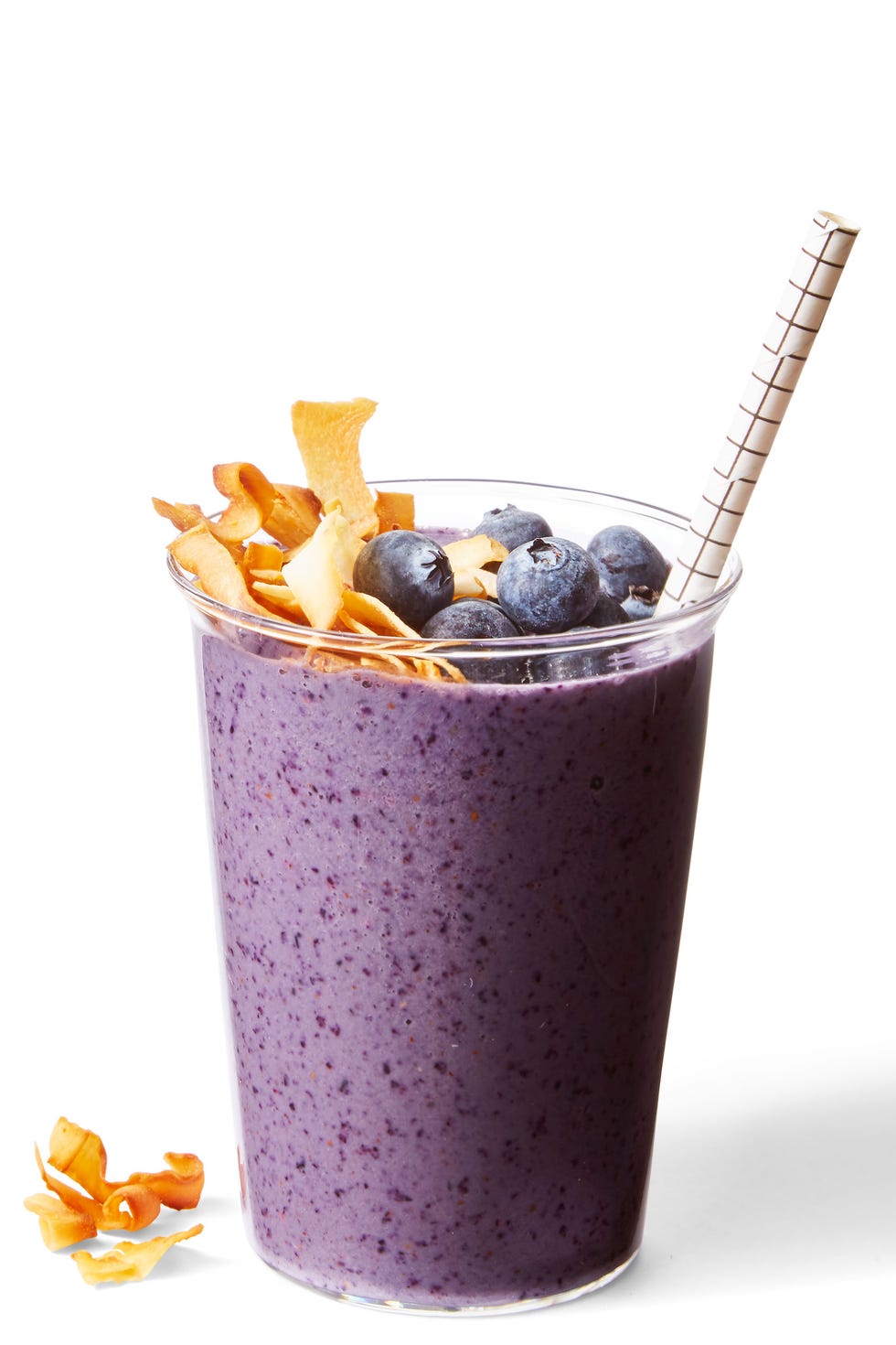 blueberry banana nut smoothie a blueberry banana nut smoothie with toasted coconut and blueberries on top