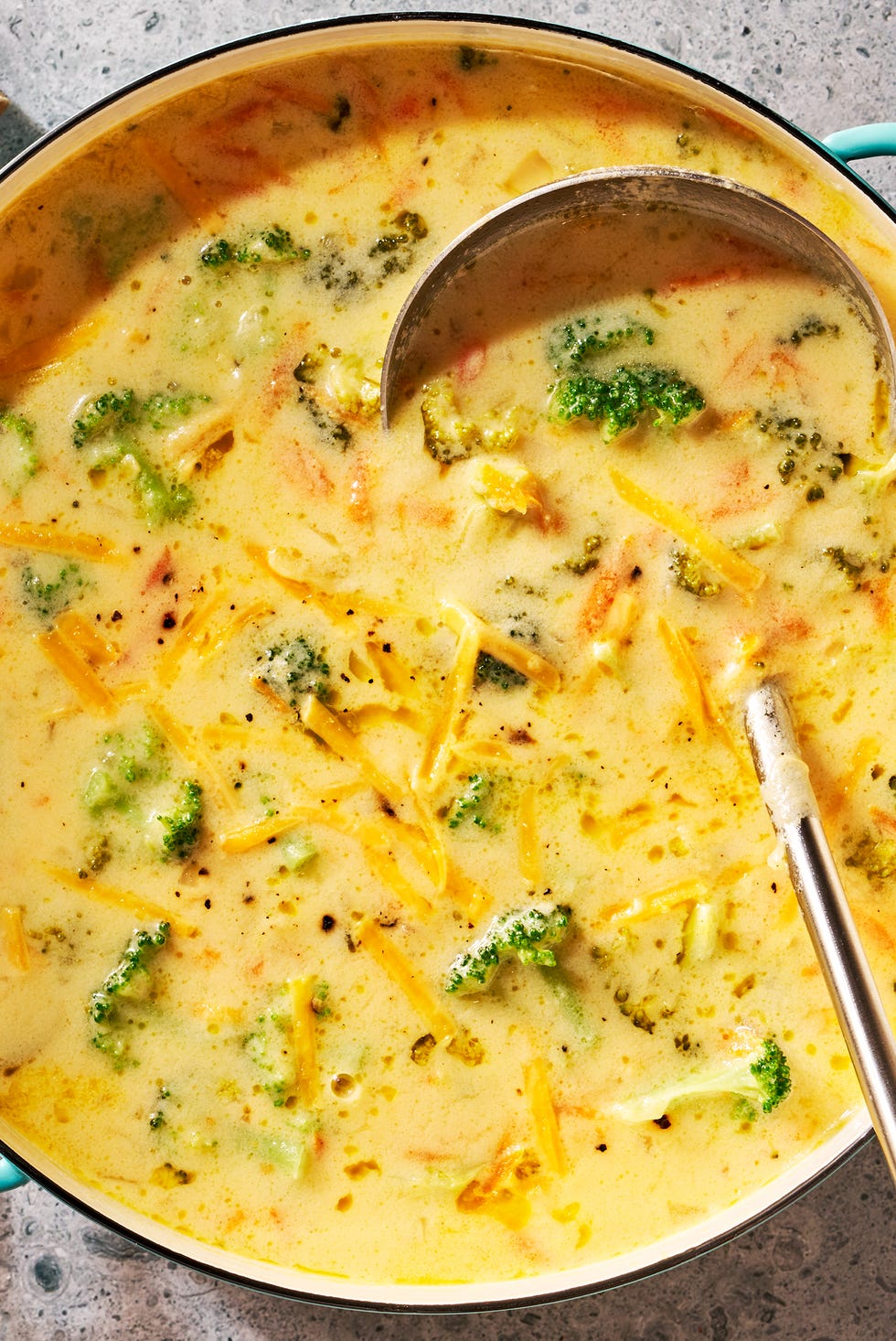 broccoli cheddar soup sprinkled with cheddar cheese