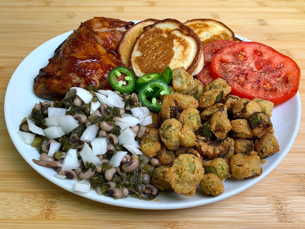 Smoked Chicken Quarter, Black Eyed Peas with Turnip Greens, Fried Cornbread, Fried Okra, Tomato, Jalapeño and White Onion