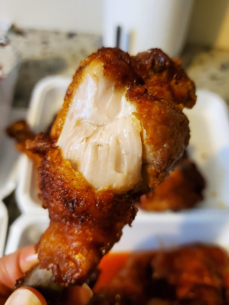 I ate the juiciest chicken wings coated with mango habanero sauce.