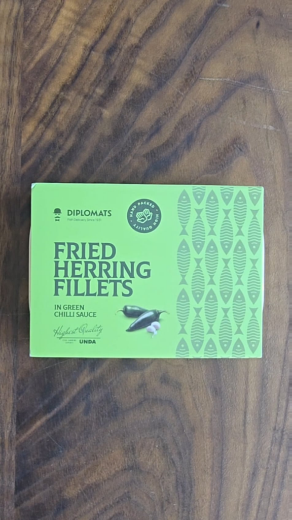 Herring in green chili sauce