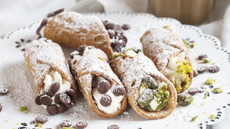 A stack of cannoli with different fillings