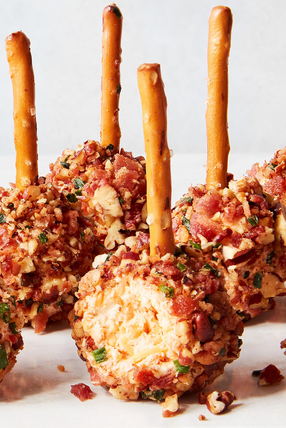 cheese ball bites with pretzel sticks
