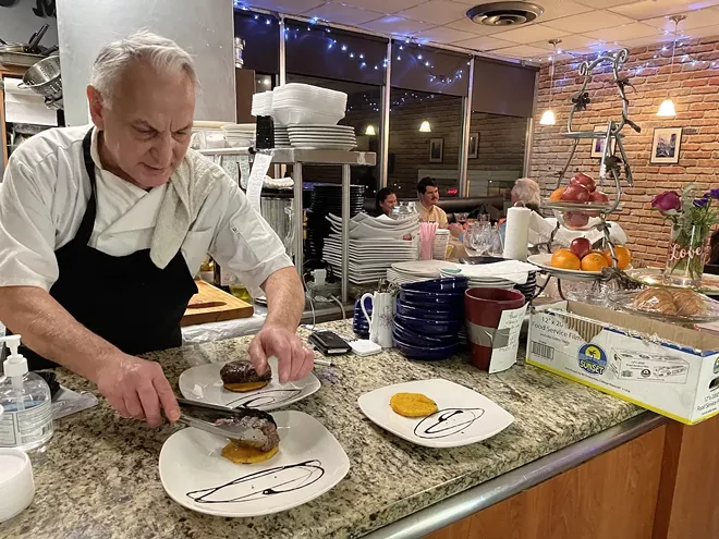 Chef Mario at work at Aroma Cafe - Photo by Zachary Schwartz