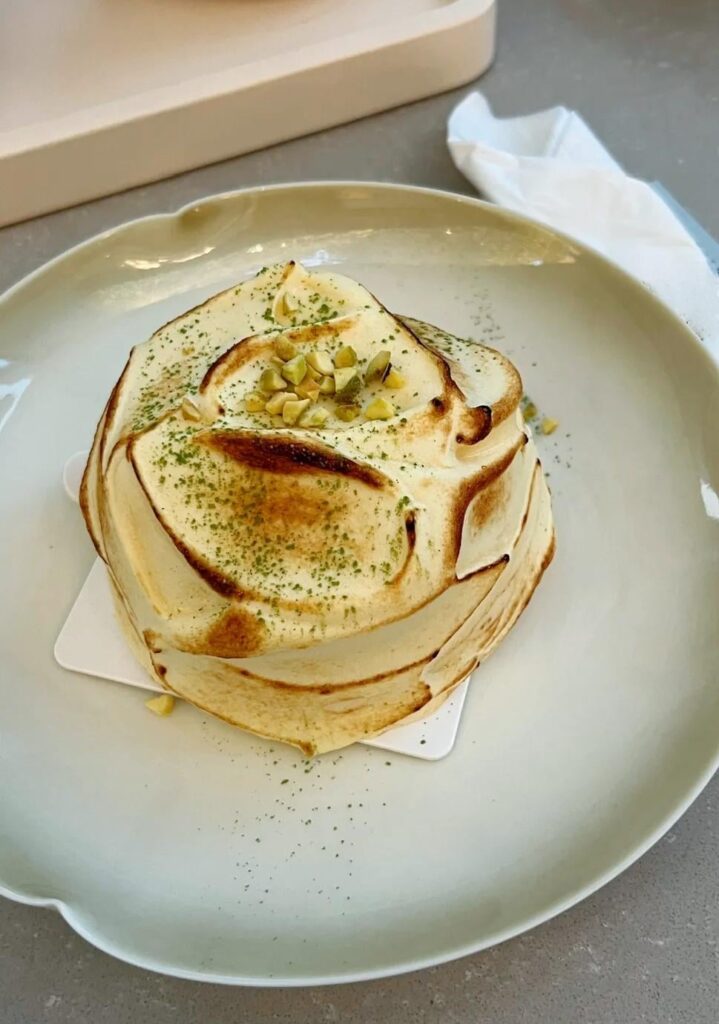 Lemon Caramel Mousse Cake with Crushed Pistachios.