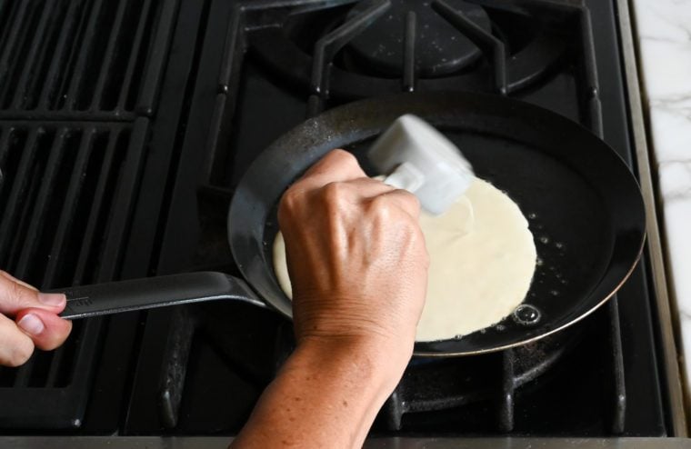 cooking crepes in crepe pan