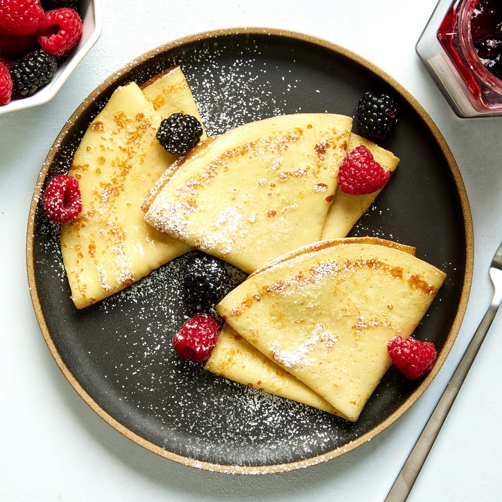 crepes with raspberries, blackberries, and dusted with powdered sugar