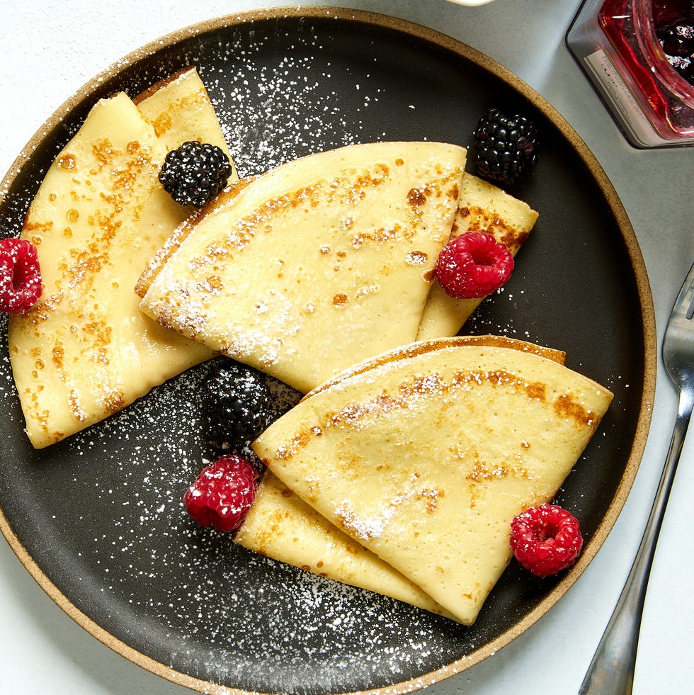 crepes with raspberries, blackberries, and dusted with powdered sugar