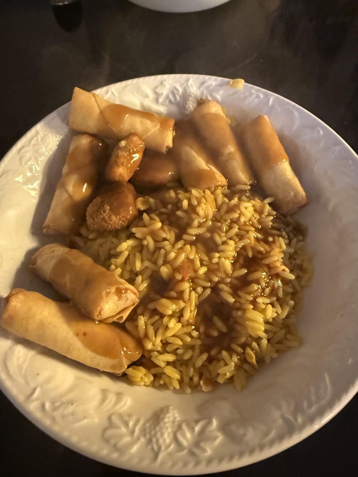Spring rolls, chicken nuggets, Rice, gravy. All the major food groups covered 🫡