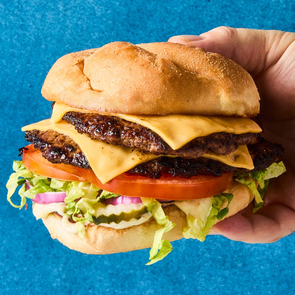 double patty with cheese, lettuce, and tomato on a bun