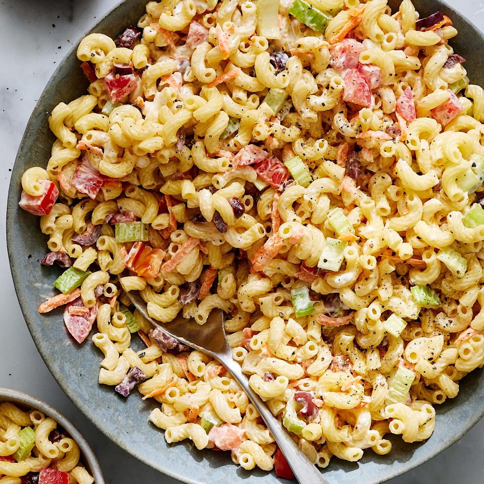 creamy macaroni salad with carrots, celery, and olives
