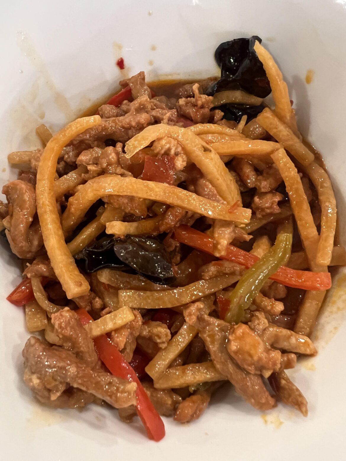What is this delicious crunchy pale vegetable in my shredded pork with garlic sauce from Ollie's?