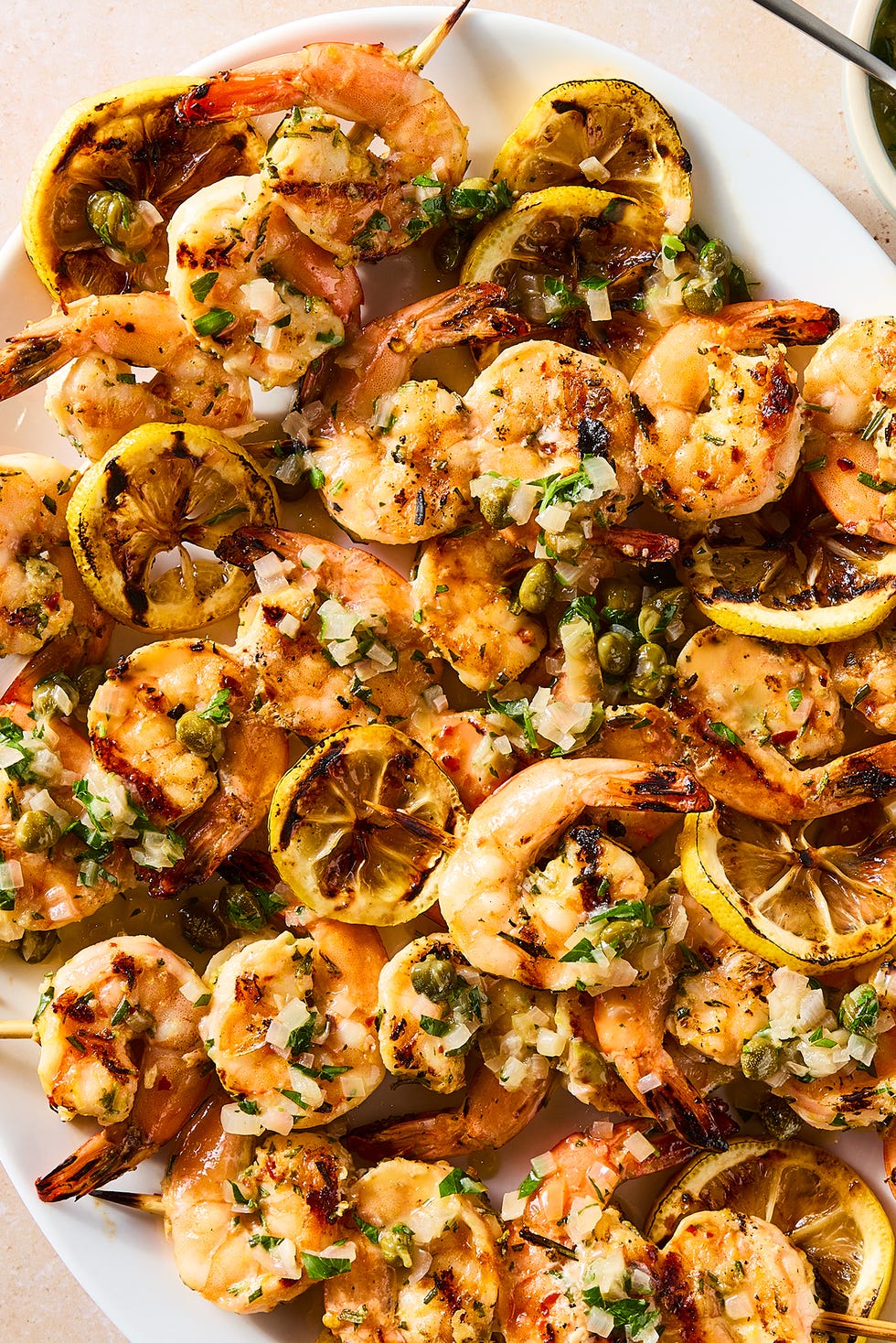 juicy, charred shrimp, bright lemon zest, briny capers, and white wine butter sauce