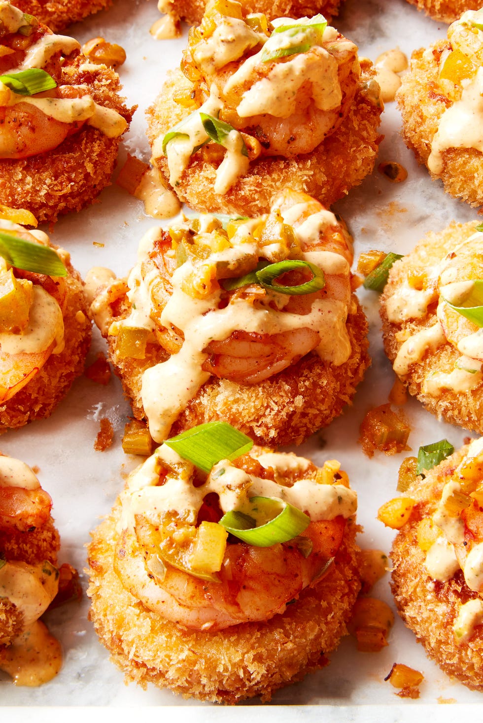 smoked gouda grits, breaded and fried until crispy then topped with cajun seasoned shrimp and creamy remoulade sauce
