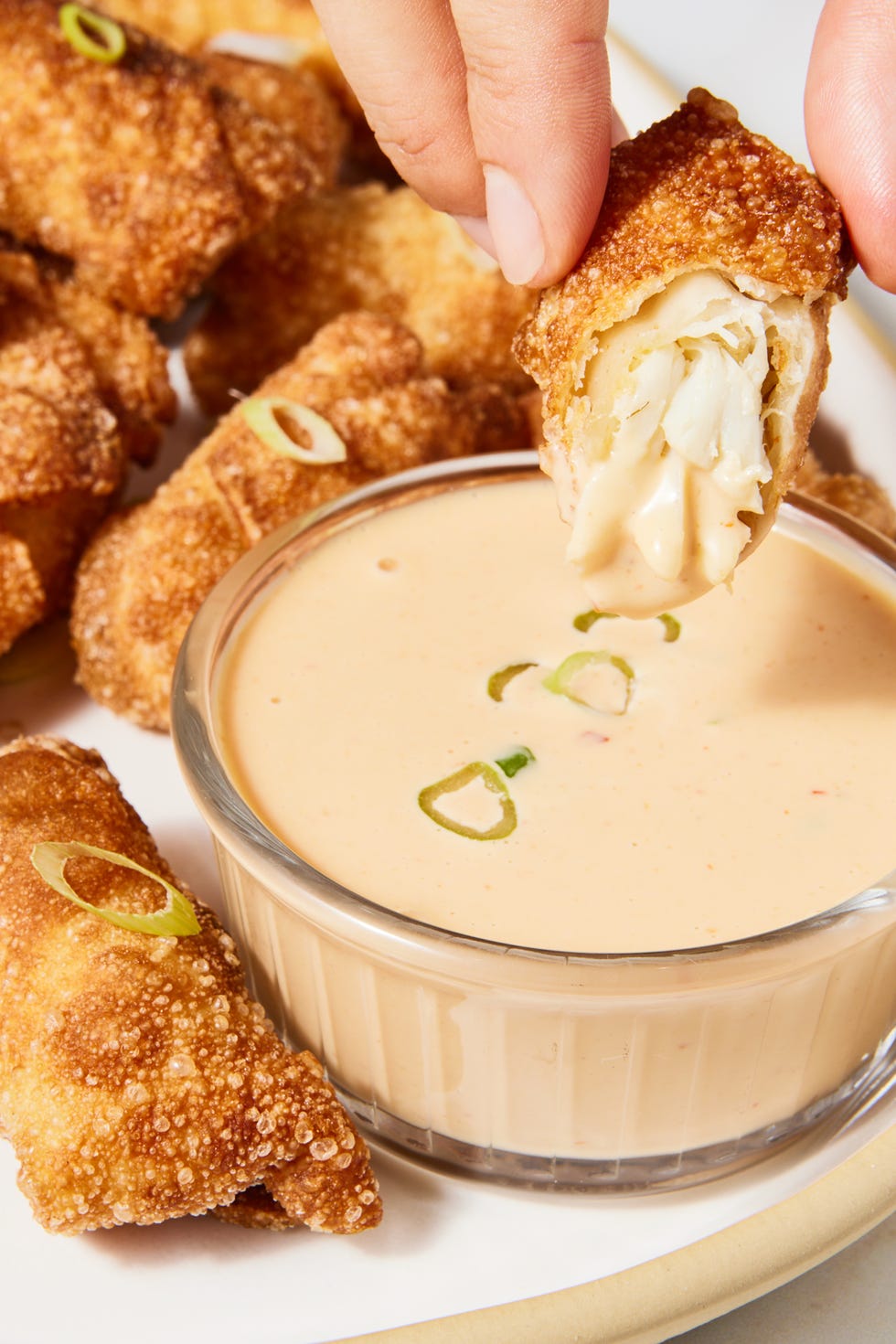 jumbo lump crab, tossed with mayo, chili garlic sauce, and old bay seasoning, folded in a wonton wrapper, then deep fried until deep golden brown and crisp