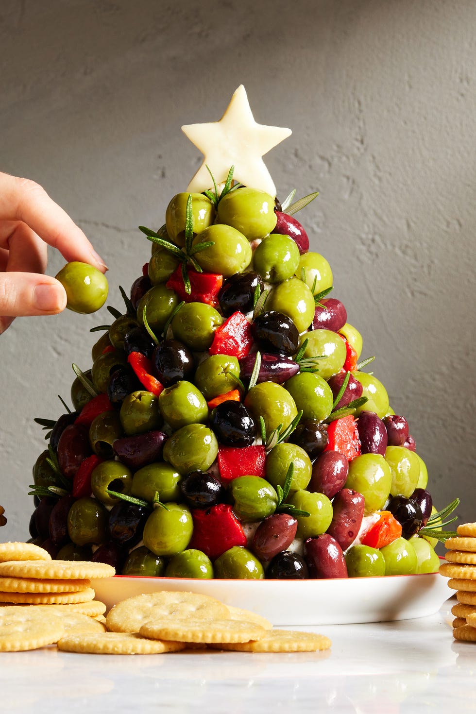 antipasto cheeseball christmas tree with pepperoncini, salami, and artichoke