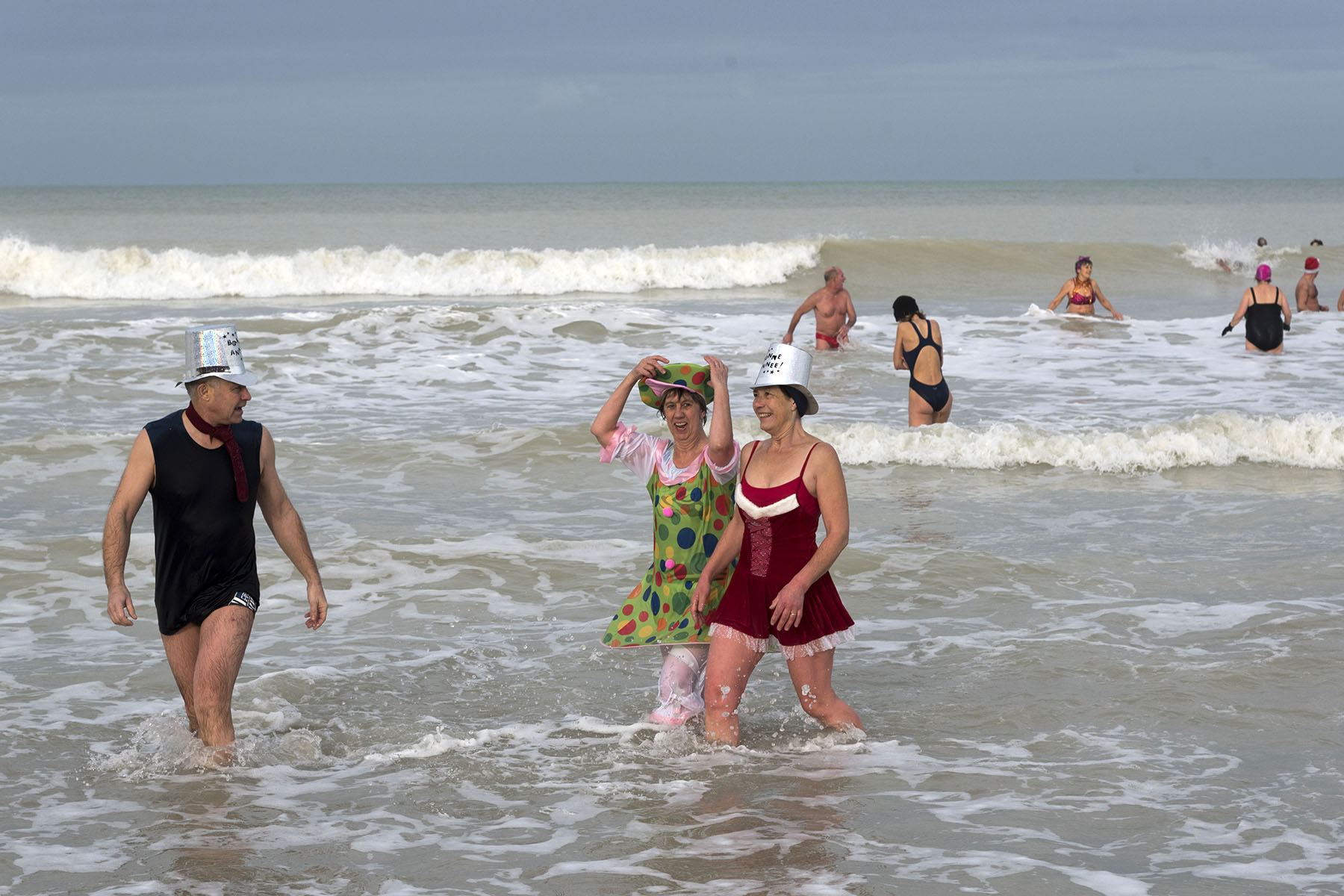 New Year bathers at Dieppe, France. Some of them are in costume.