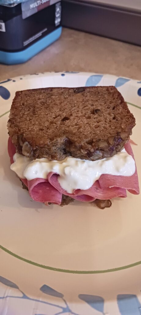 Banana bread, cottage cheese, and pastrami sandwich