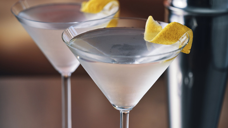 Two martinis with lemon peels