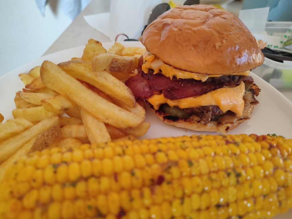 Double bacon cheese, fries, seasoned corn.