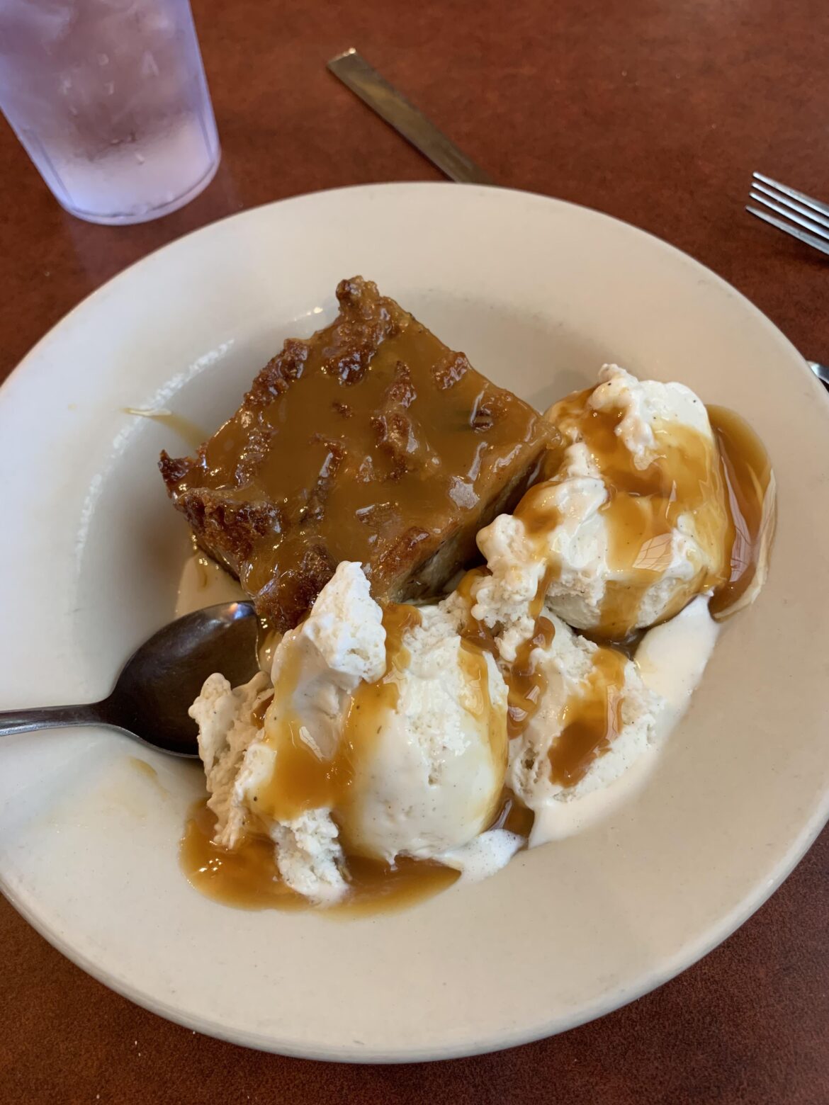 Caramel pecan bread pudding with vanilla ice cream