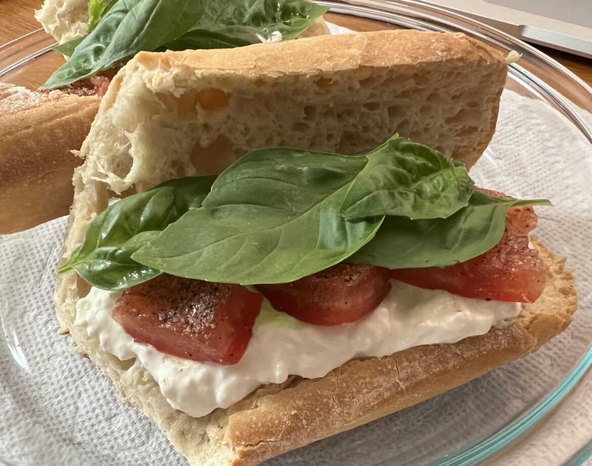 Tomato, burrata, & basil on a baguette