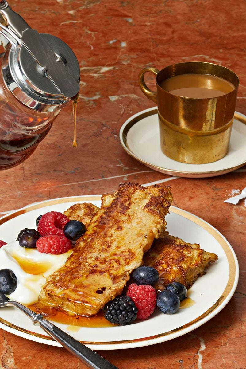 Focaccia French Toast focaccia french toast with syrup, whipped cream and berries