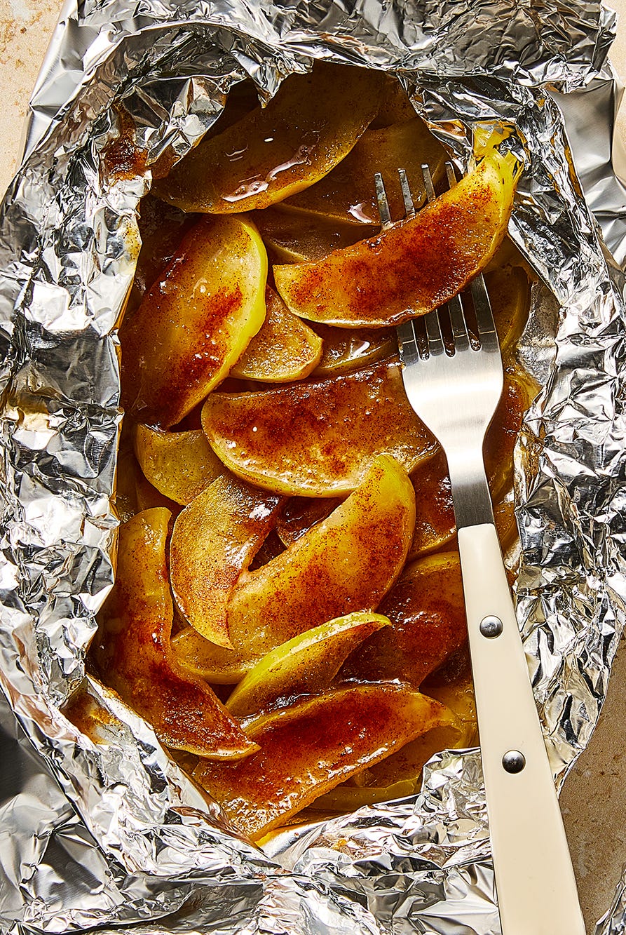 apples dusted in cinnamon in foil packs