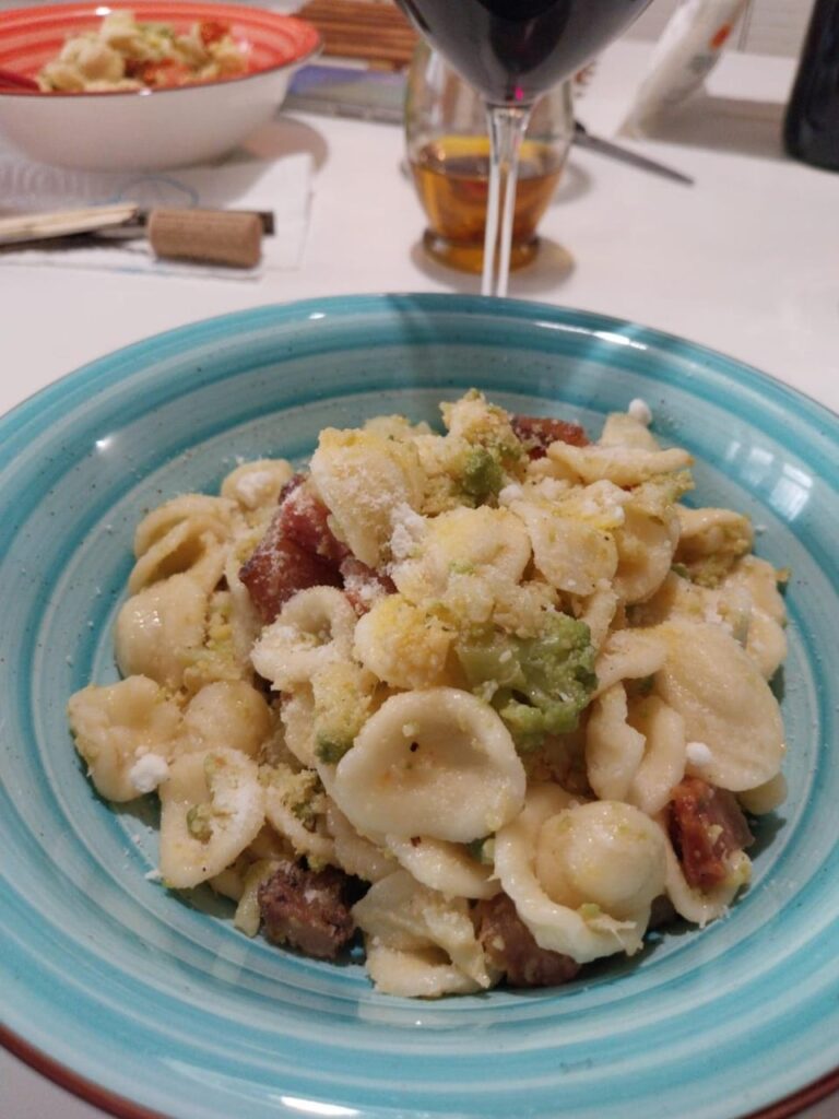 Fresh Orecchiette with green cauliflower, guanciale, cherry tomatoes & pecorino romano cheese