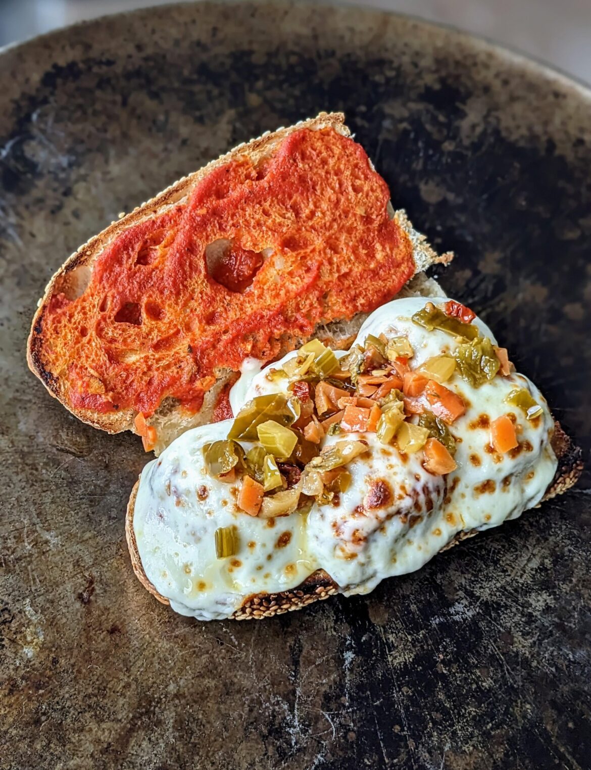 Meatball sub on homemade sesame roll
