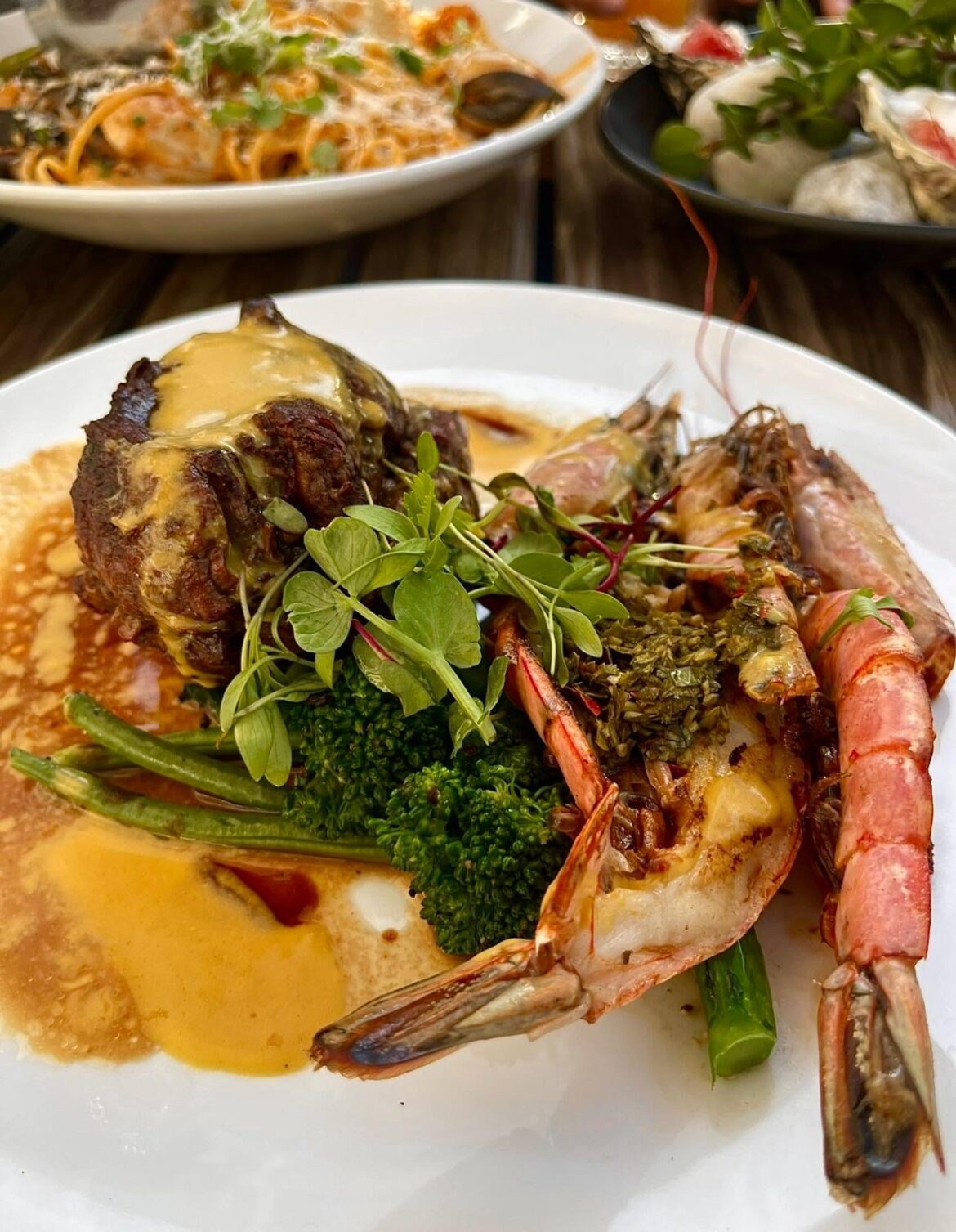 Seafood pasta, oysters and a surf & turf.