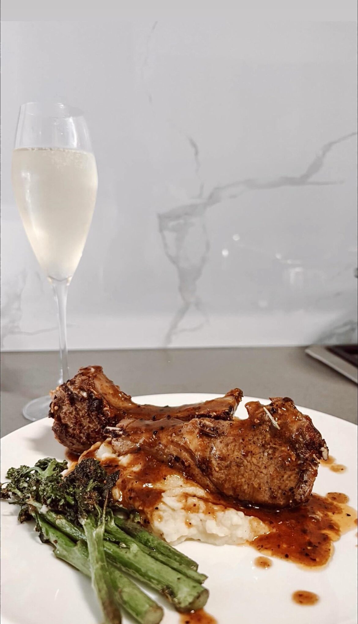 Homemade lamb chops, mash and brocollini.