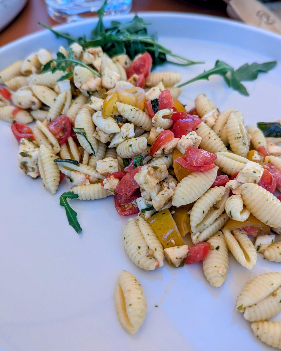 Pasta (malloreddus) salad with cherry tomatoes, mozzarella, and herbs