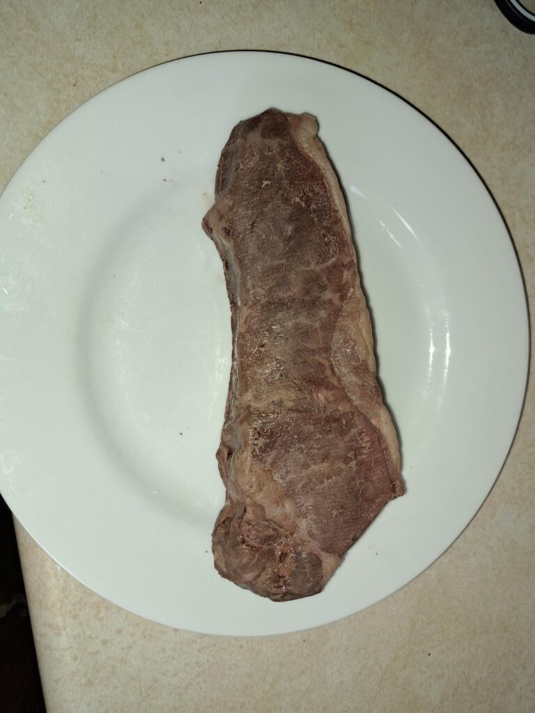 137 NY Strip seared with 500k BTU torch.